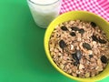 Healthy Breakfast whole grain oat cereal with seeds and glass of milk