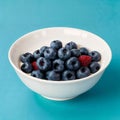 Healthy breakfast with yoghurt, berries and fruits on blue background Royalty Free Stock Photo