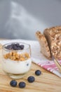 Healthy Breakfast: yogurt with blueberries and corn cereals and h Royalty Free Stock Photo