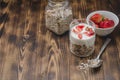 Healthy breakfast. Yogurt, fresh strawberry, homemade granola in open glass jar on a wooden table. Copyspace Royalty Free Stock Photo