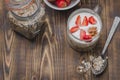 Healthy breakfast. Yogurt, fresh strawberry,  spoon with the scattered granule on a wooden table. Copyspace, top view Royalty Free Stock Photo