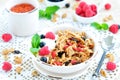 Healthy breakfast, yogurt with granola and berries on the white table Royalty Free Stock Photo