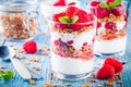 Healthy breakfast: yogurt parfait with granola and fresh raspberries Royalty Free Stock Photo