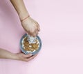 A young woman is pouring cereals with milk. Healthy breakfast. Royalty Free Stock Photo