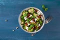 Healthy broccoli salad with feta cheese sun dried tomatoes pine nuts.. vegetarian low carb keto diet