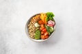 Healthy buddha bowl with chicken, quinoa and fresh vegetables