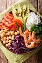 Healthy Buddha bowl with raw vegetables, shrimp, chickpeas, rice Royalty Free Stock Photo