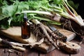 Healthy burdock root and fresh plant leaves on cutting board on rustic background