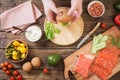 the healthy burger in hand on old wooden background