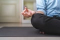 Healthy business young man doing yoga for mediation on home office floor. Businessman meditates in lotus pose for relax, relief Royalty Free Stock Photo