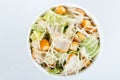 Fresh healthy caesar salad. on white background. Top view Royalty Free Stock Photo
