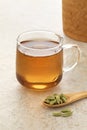 Healthy Cardamom tea  with a spoon cardamom pods in front Royalty Free Stock Photo