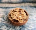 Healthy cereals in wooden bowl