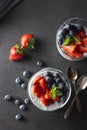 Healthy chia pudding in a glass with fresh berries. Healthy breakfast. Dark food photo food