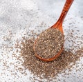 Healthy Chia seeds in a wooden spoon on the table close-up. Royalty Free Stock Photo