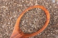 Healthy Chia seeds in a wooden spoon on the table close-up. Royalty Free Stock Photo