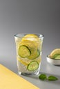 Healthy chia water with cucumber and lemon in a glass.