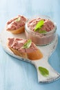 Healthy chicken liver pate with sage in jar and on bread Royalty Free Stock Photo