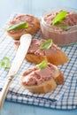 Healthy chicken liver pate with sage in jar and on bread Royalty Free Stock Photo