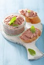 Healthy chicken liver pate with sage in jar and on bread Royalty Free Stock Photo