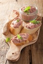 Healthy chicken liver pate with sage in jar and on bread Royalty Free Stock Photo