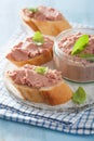 Healthy chicken liver pate with sage in jar and on bread Royalty Free Stock Photo