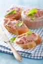 Healthy chicken liver pate with sage in jar and on bread Royalty Free Stock Photo