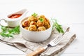 Healthy chicken meatballs with greens and tomato sauce on white background Royalty Free Stock Photo