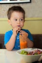 Healthy child with fresh carrot juice Royalty Free Stock Photo