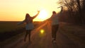 Healthy Children run on the road with an airplane in hand. Silhouette of free children playing airplane. Dreams of Royalty Free Stock Photo