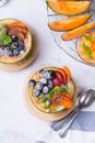 Fruit salad with yogurt in carved melon cantaloupe bowl Royalty Free Stock Photo