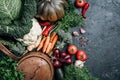 Healthy, clean food cooking and eating concept. Copper pan, colorful autumn vegetables on dark background. Top view Royalty Free Stock Photo