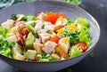 Healthy cobb salad with chicken, avocado, bacon, tomato, cheese and eggs