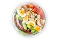 Healthy cobb salad in plastic package for take away or food delivery isolated on white background. top view Royalty Free Stock Photo