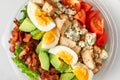 Healthy cobb salad in plastic package for take away or food delivery on white background. top view. keto diet Royalty Free Stock Photo