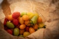 Healthy colorful cherry tomatoes in paper bag