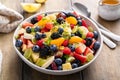 Healthy and colorful fruit salad with orange dressing and fresh mint Royalty Free Stock Photo