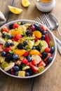 Healthy and colorful fruit salad with orange dressing and fresh mint Royalty Free Stock Photo