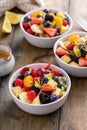 Healthy and colorful fruit salad with orange dressing and fresh mint Royalty Free Stock Photo