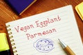Healthy concept meaning Vegan Eggplant Parmesan with phrase on the sheet
