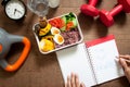 Healthy concept with nutrion food in lunch box and fitness equip Royalty Free Stock Photo