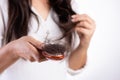 Healthy concept. Woman show her brush with damaged long loss hair and looking at her hair Royalty Free Stock Photo