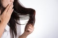 Healthy concept. Woman show her brush with damaged long loss hair and looking at her hair Royalty Free Stock Photo