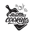 Healthy cooking lettering illustration on cutting board with vegetables. Vector illustration