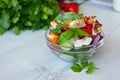 Healthy cooking of salad with fresh delicious ingredients making on cutting board. Royalty Free Stock Photo