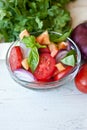 Healthy cooking of salad with fresh delicious ingredients making on cutting board.