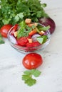 Healthy cooking of salad with fresh delicious ingredients making on cutting board.