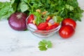 Healthy cooking of salad with fresh delicious ingredients making on cutting board. Royalty Free Stock Photo