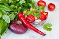 Healthy cooking of salad with fresh delicious ingredients making on cutting board. Royalty Free Stock Photo