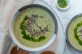 Healthy creamy soup with fresh ramson or wild garlic leaves